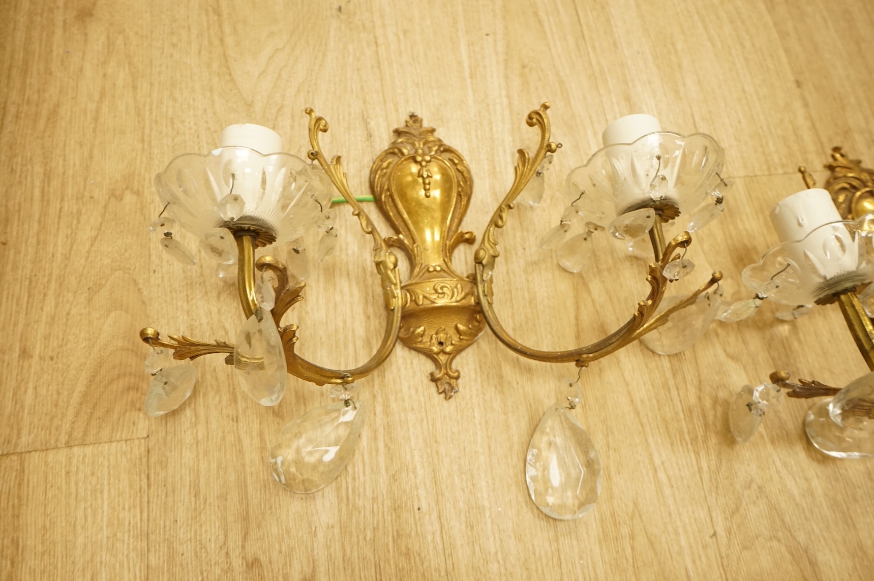 Five cast brass and glass wall lights